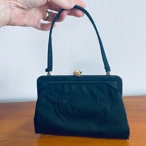 Elegant Black Wristlet with Gold-Tone Clasp